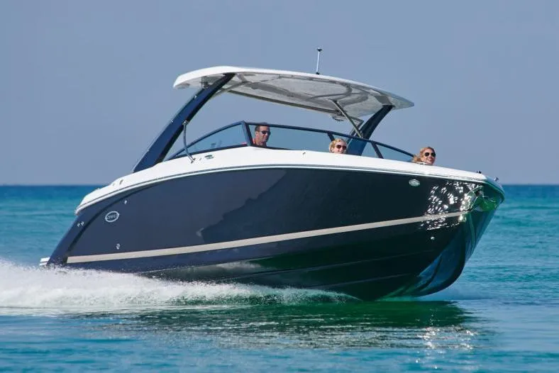 Slide: The Image of Manufacturer Provided Image: 2021 Cobalt 30SC boat cruising on clear blue water. - 23