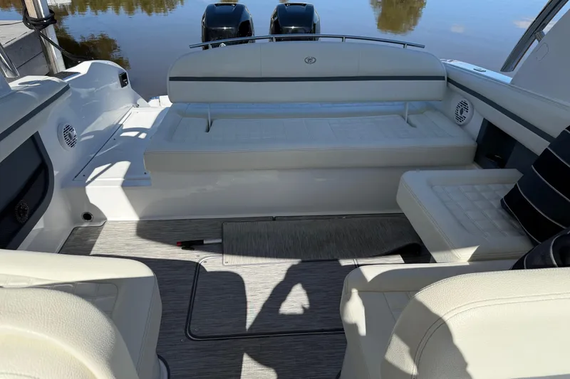 Slide: The Image of 2021 Cobalt 30SC boat interior with white seating and modern design. - 4