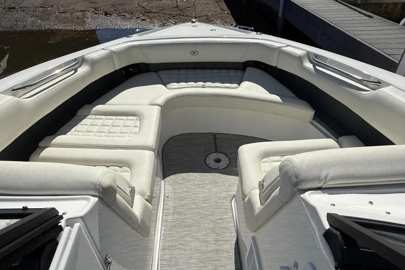 Slide: The Image of 2021 Cobalt 30SC boat interior with luxurious white seating and modern design. - 7