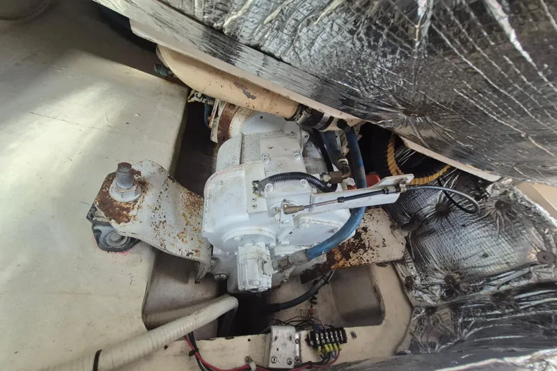 Slide: The Image of Engine compartment of a 1999 Nauset 33 Bridge Deck boat, showing mechanical components. - 20