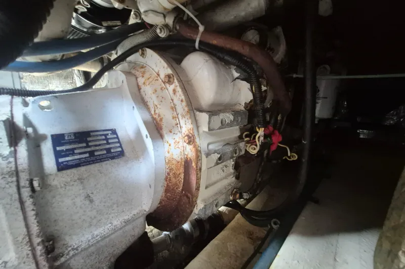 Slide: The Image of Engine compartment of a 1999 Nauset 33 Bridge Deck boat, showing mechanical components. - 22