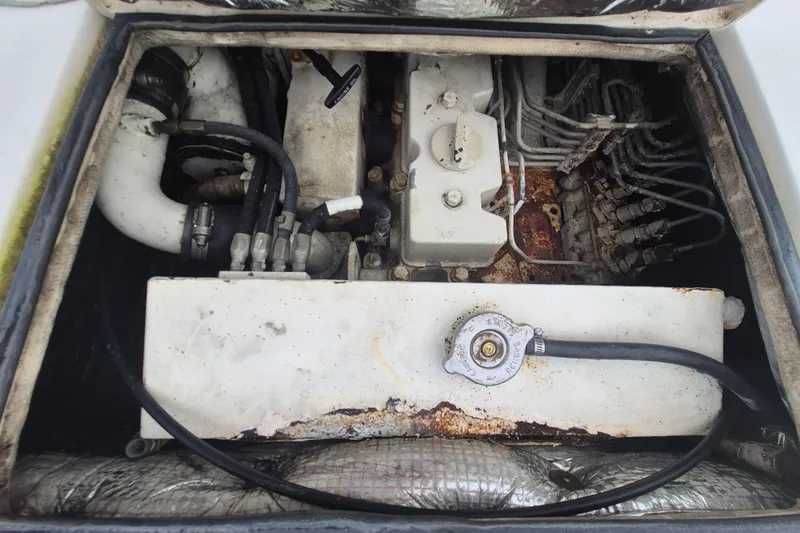 Slide: The Image of Engine compartment of a 1999 Nauset 33 Bridge Deck boat, showing mechanical components. - 23