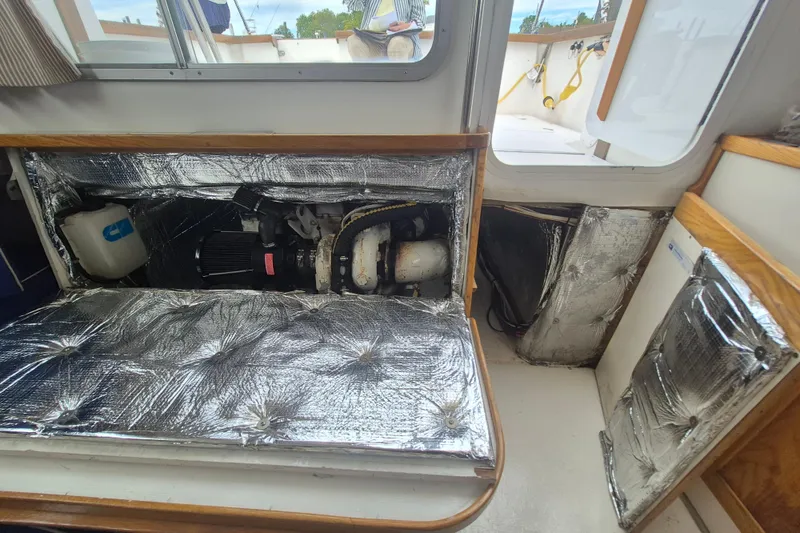 Slide: The Image of 1999 Nauset 33 Bridge Deck engine compartment with insulation and visible components. - 30