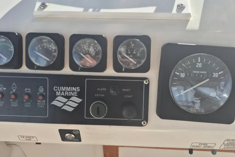 Slide: The Image of Instrument panel of a 1999 Nauset 33 Bridge Deck with Cummins Marine gauges. - 38