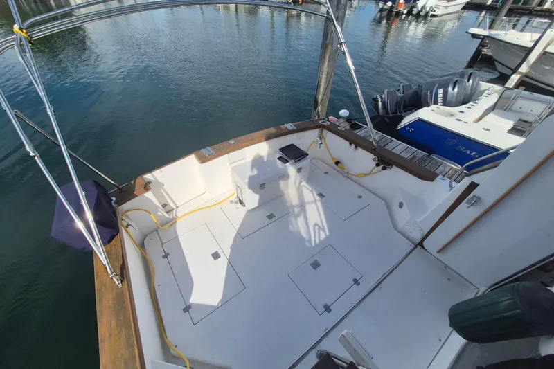 Slide: The Image of 1999 Nauset 33 Bridge Deck boat docked, featuring spacious deck and modern amenities. - 41