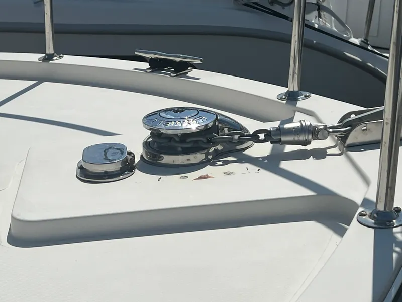 Slide: The Image of Anchor winch on 2001 Camano 31 Troll boat deck, featuring stainless steel fittings. - 12
