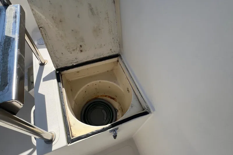 Slide: The Image of Open storage compartment on 2001 Camano 31 Troll boat deck. - 19