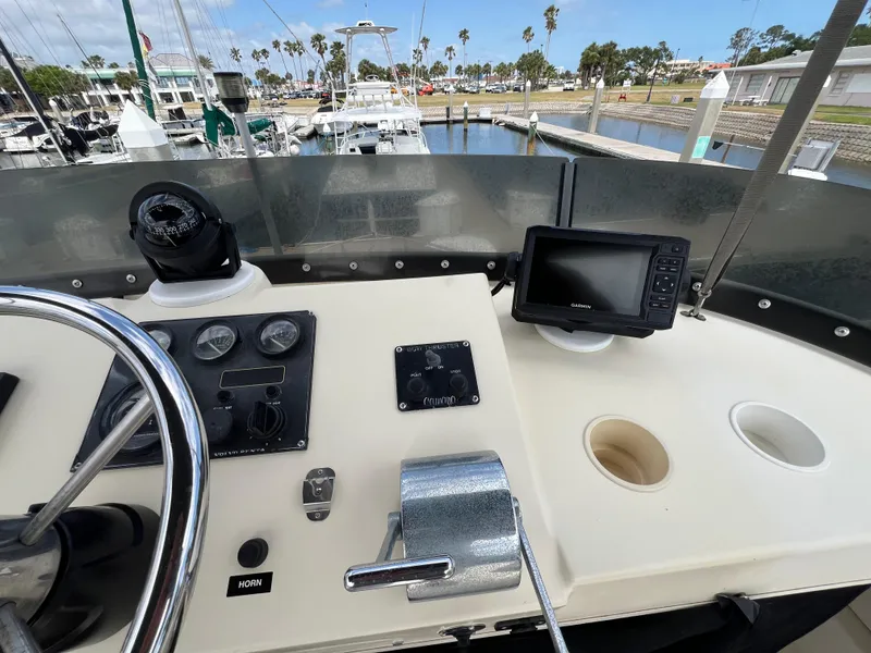 Slide: The Image of Helm of 2001 Camano 31 Troll boat with navigation equipment and controls. - 21