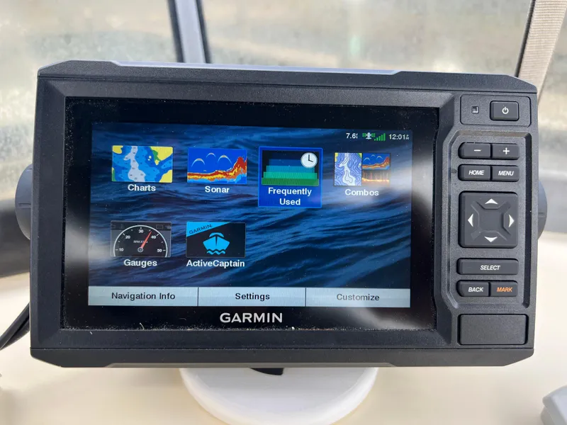 Slide: The Image of Garmin navigation system on 2001 Camano 31 Troll boat, displaying charts and sonar options. - 22