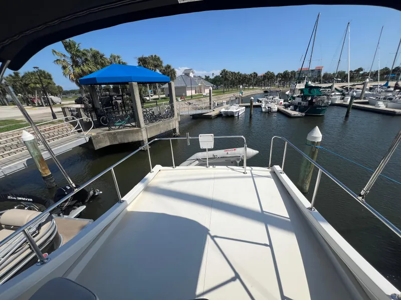 Slide: The Image of Camano 31 Troll 2001 yacht docked at marina with scenic waterfront view. - 29