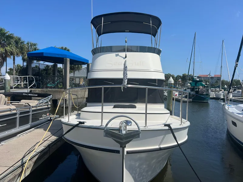 Slide: The Image of 2001 Camano 31 Troll boat docked at marina under clear blue sky. - 3