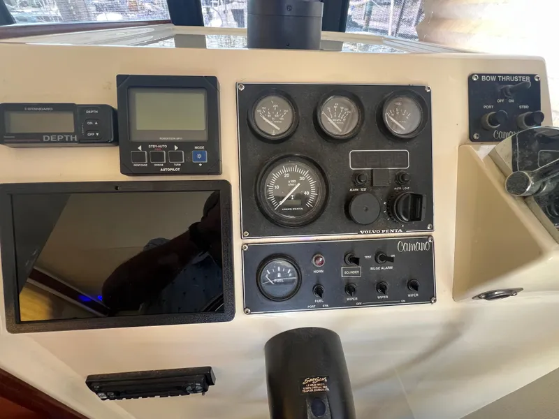 Slide: The Image of Control panel of a 2001 Camano 31 Troll boat with gauges and navigation equipment. - 42
