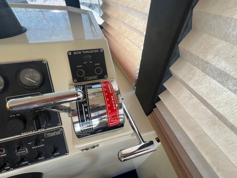 Slide: The Image of Control panel of a 2001 Camano 31 Troll boat with throttle and bow thruster. - 43