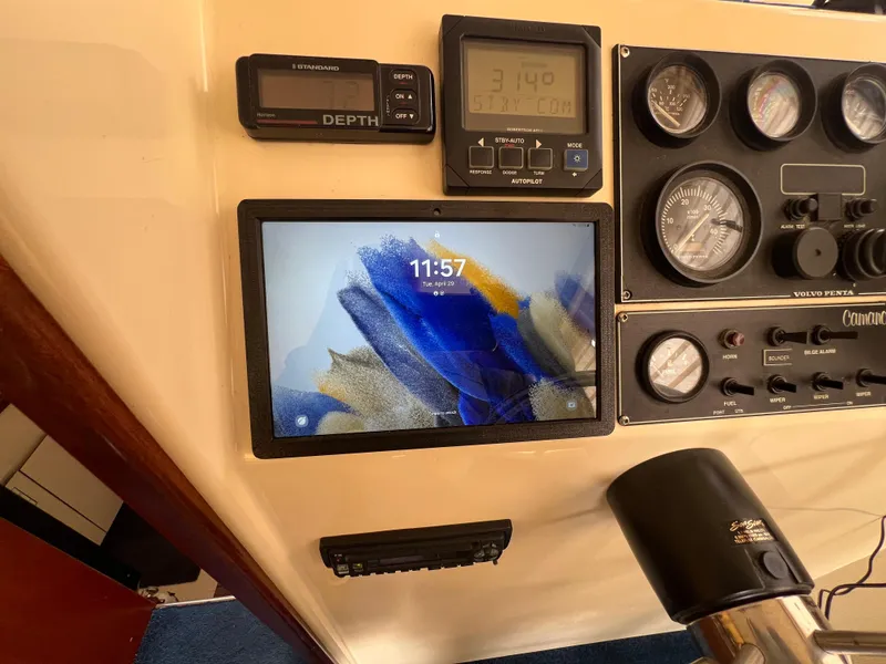 Slide: The Image of Control panel of a 2001 Camano 31 Troll boat with gauges and a digital display. - 44