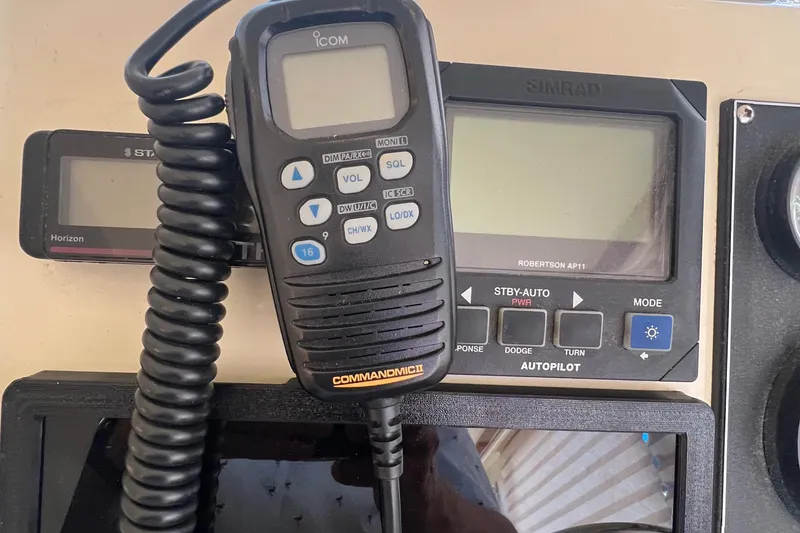 Slide: The Image of Control panel of a 2001 Camano 31 Troll boat with communication and navigation equipment. - 47