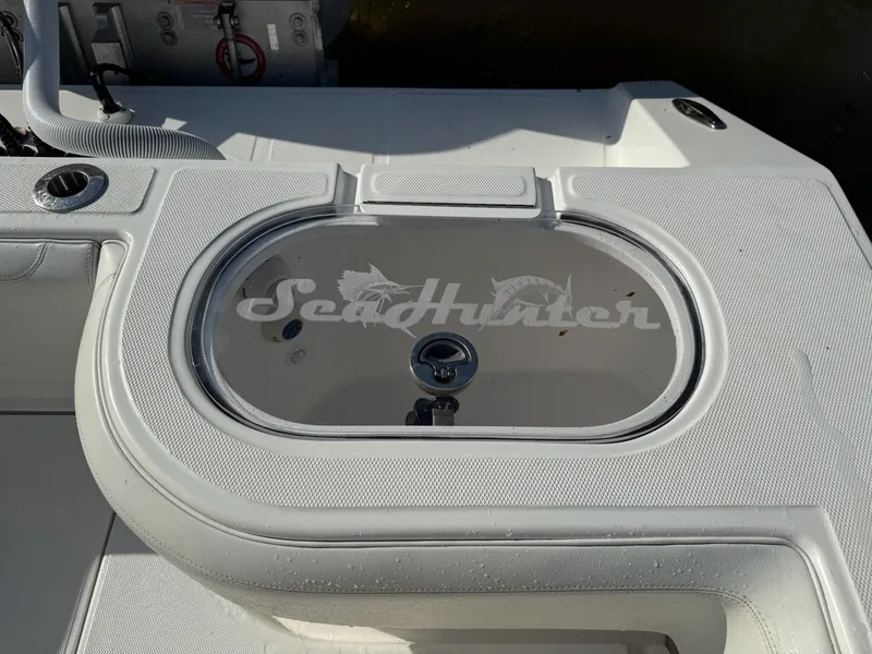 Slide: The Image of 2023 SeaHunter 28 Floridian boat deck with branded livewell. - 22
