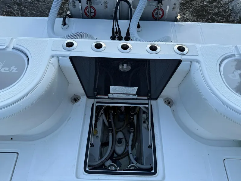Slide: The Image of 2023 SeaHunter 28 Floridian boat deck with open hatch and visible wiring. - 29