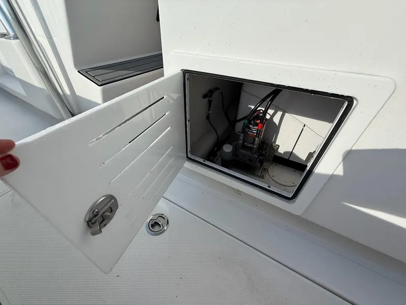 Slide: The Image of Open compartment on 2023 SeaHunter 28 Floridian boat, showing interior equipment. - 33