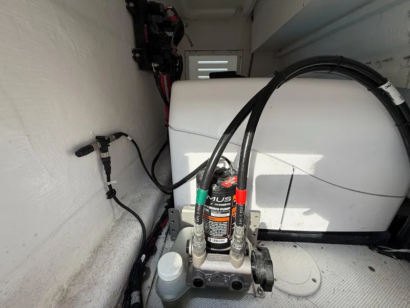 Slide: The Image of 2023 SeaHunter 28 Floridian boat interior showing hydraulic pump and wiring setup. - 35