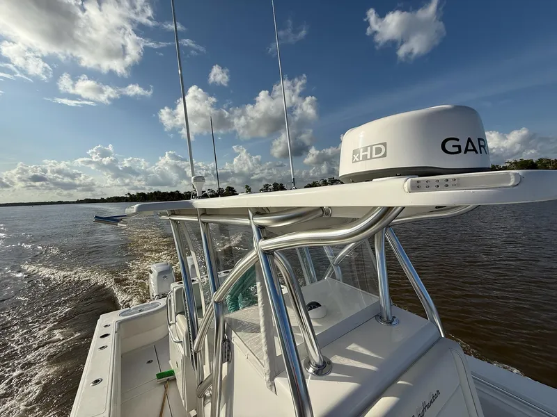 Slide: The Image of 2023 SeaHunter 28 Floridian boat cruising on a sunny day with Garmin radar. - 42