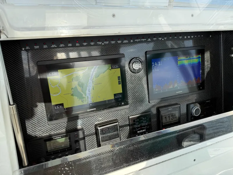 Slide: The Image of Dashboard of 2023 SeaHunter 28 Floridian with navigation and control displays. - 45