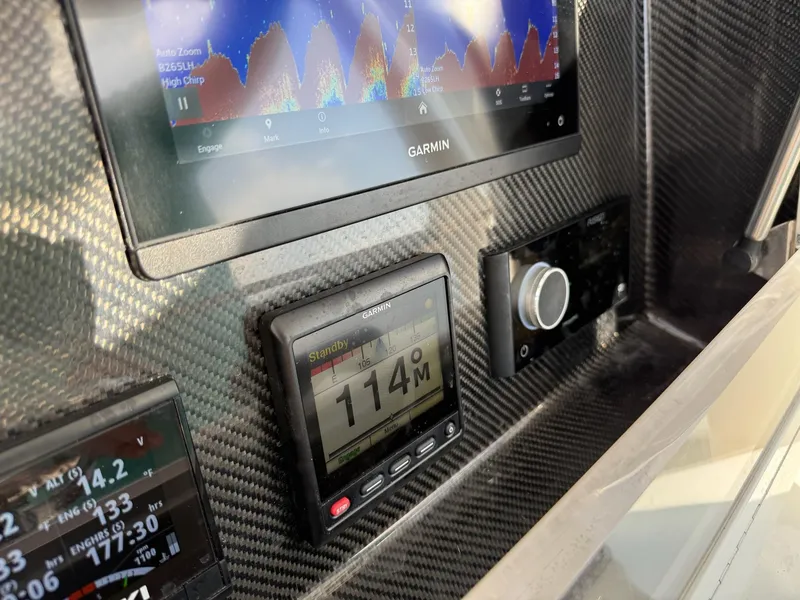 Slide: The Image of Dashboard of 2023 SeaHunter 28 Floridian with Garmin navigation displays. - 49