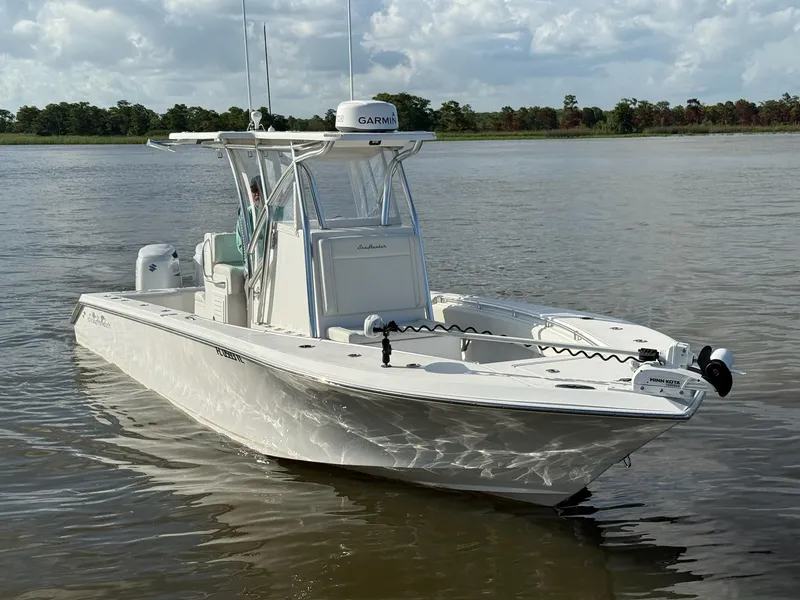 Slide: The Image of 2023 SeaHunter 28 Floridian boat on calm water, featuring a sleek design and advanced navigation equipment. - 6