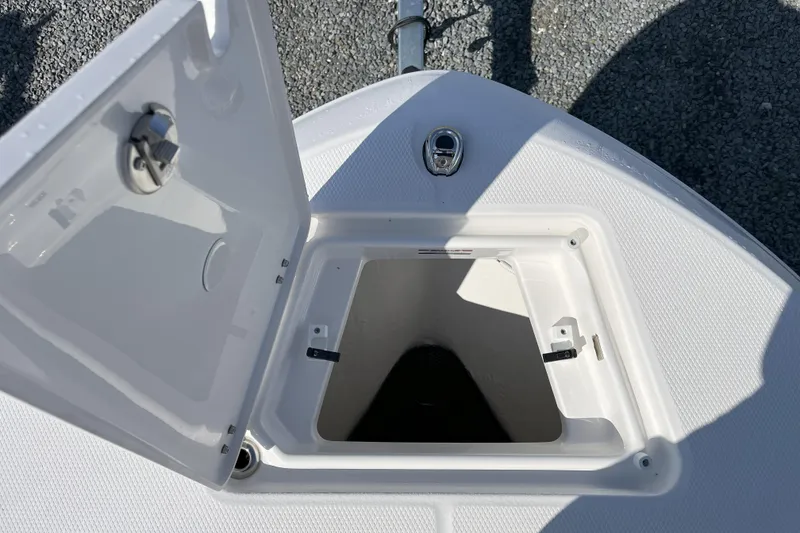 Slide: The Image of Open storage compartment on 2026 Robalo R202 Explorer boat. - 8