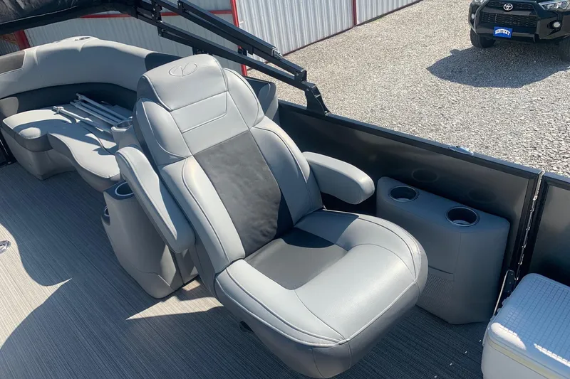 Slide: The Image of Luxurious seating on 2020 Veranda Relax VR22RC pontoon boat, featuring cup holders and armrests. - 10
