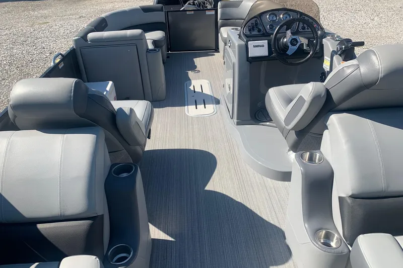 Slide: The Image of 2020 Veranda Relax VR22RC pontoon boat interior with gray seating and steering console. - 14