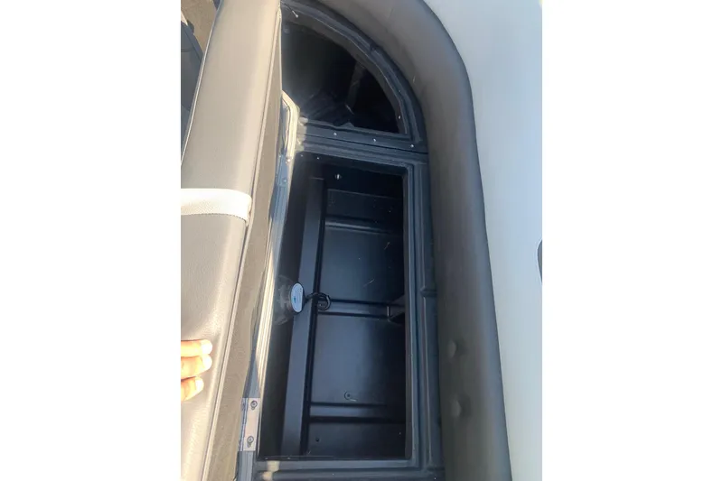 Slide: The Image of Open storage compartment in 2020 Veranda Relax VR22RC boat seat. - 15