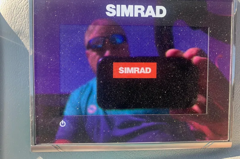 Slide: The Image of Simrad display on Veranda Relax VR22RC 2020 boat, showing reflection. - 19