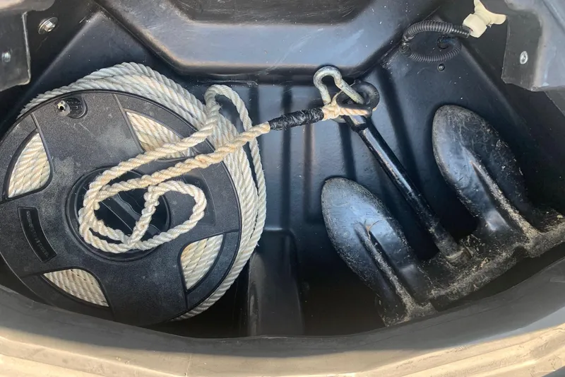 Slide: The Image of Storage compartment of 2020 Veranda Relax VR22RC with anchor and coiled rope. - 26