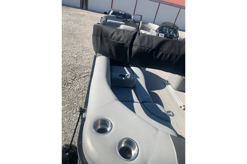 Slide: The Image of 2020 Veranda Relax VR22RC boat interior with gray seating and cup holders. - 33