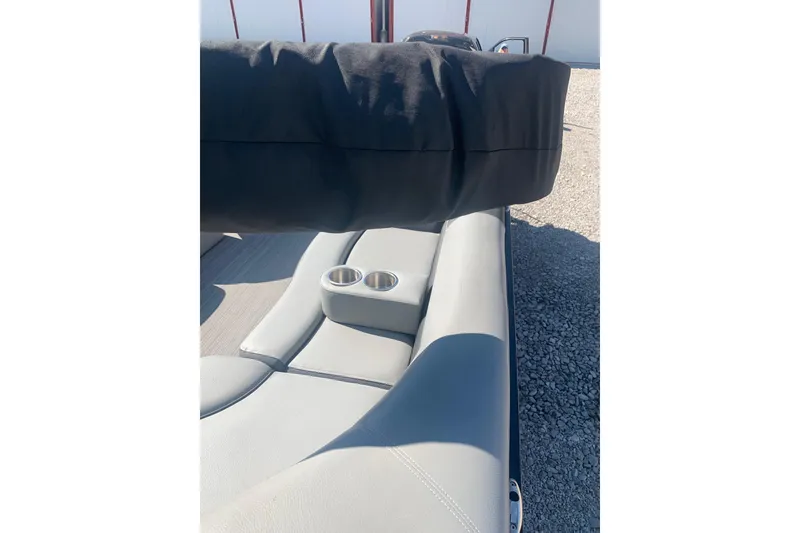 Slide: The Image of 2020 Veranda Relax VR22RC boat interior with gray seating and cup holders. - 34