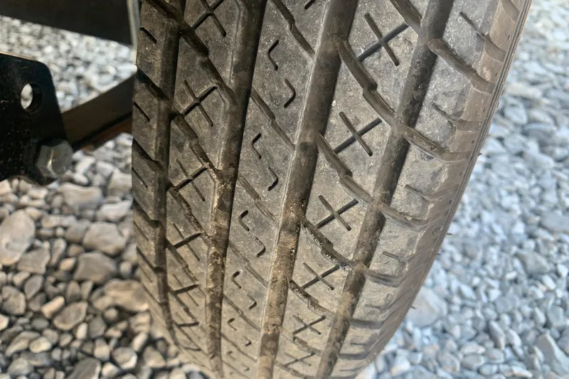 Slide: The Image of Close-up of a 2020 Veranda Relax VR22RC tire on gravel surface. - 35