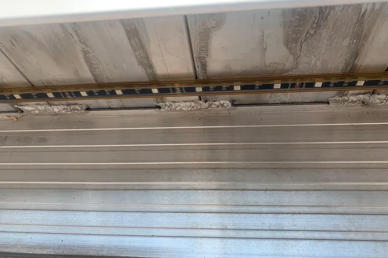 Slide: The Image of Interior view of a 2020 Veranda Relax VR22RC boat ceiling with LED strip lighting. - 39