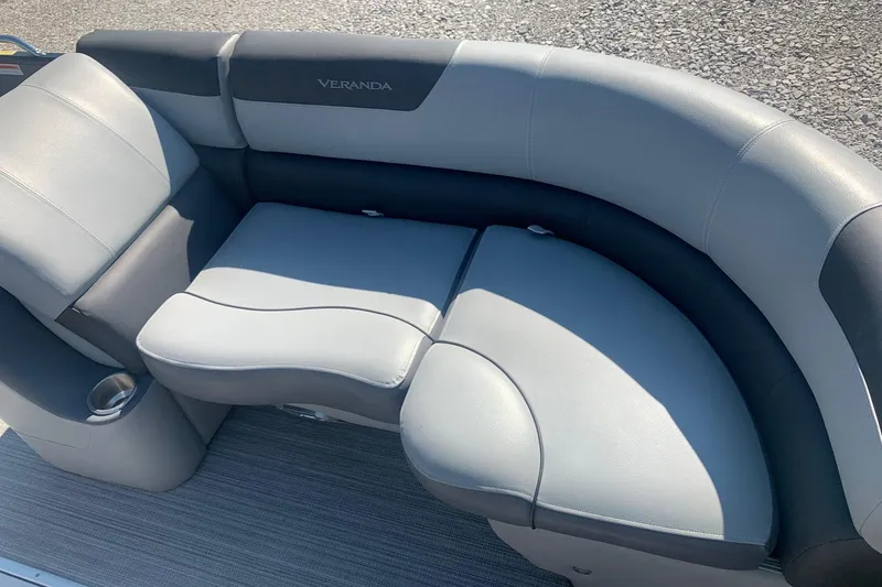 Slide: The Image of Luxurious seating on 2020 Veranda Relax VR22RC pontoon boat, featuring sleek gray upholstery. - 8