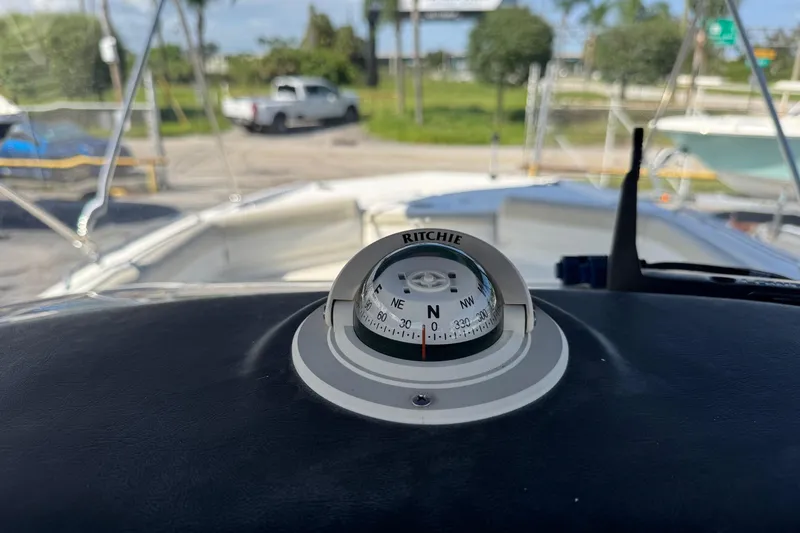Slide: The Image of 2015 NauticStar 231 Angler boat with Ritchie compass on dashboard. - 10