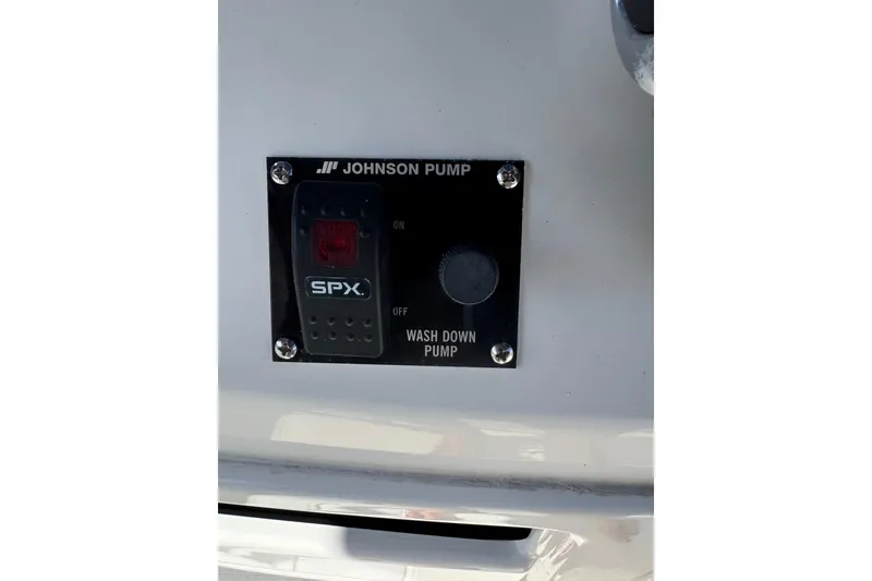 Slide: The Image of 2015 NauticStar 231 Angler wash down pump switch by Johnson Pump. - 11
