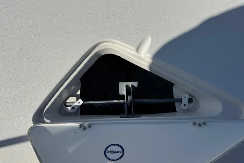 Slide: The Image of Anchor compartment of 2015 NauticStar 231 Angler boat, featuring secure storage and sleek design. - 24