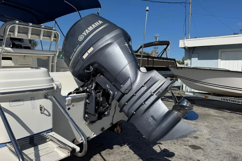 Slide: The Image of 2015 NauticStar 231 Angler with Yamaha outboard motor in a marina setting. - 35