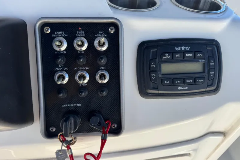 Slide: The Image of Control panel and audio system on a 2015 NauticStar 231 Angler boat. - 8