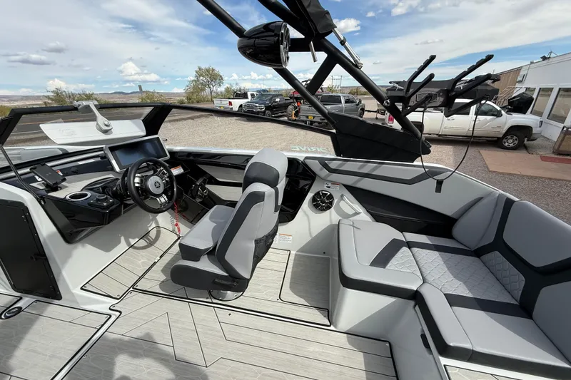 Slide: The Image of 2024 Yamaha Boats 222XD interior with modern helm, seating, and sleek design. - 10