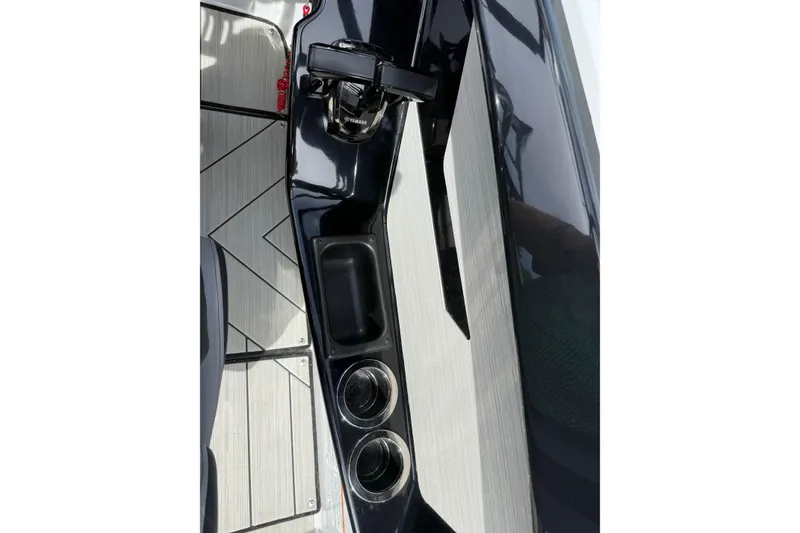Slide: The Image of 2024 Yamaha Boats 222XD interior with sleek design and cup holders. - 18