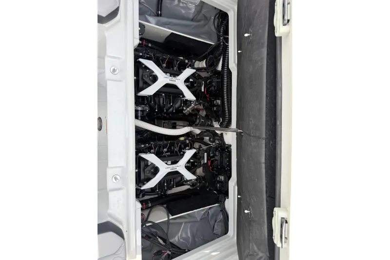 Slide: The Image of 2024 Yamaha Boats 222XD engine compartment showcasing dual engines and advanced mechanics. - 19