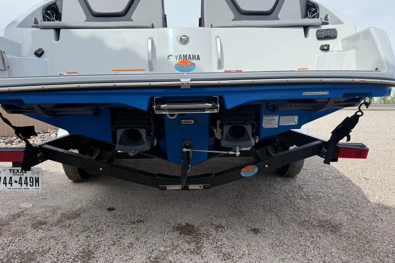 Slide: The Image of Rear view of 2024 Yamaha Boats 222XD on trailer, showcasing dual jet propulsion system. - 7
