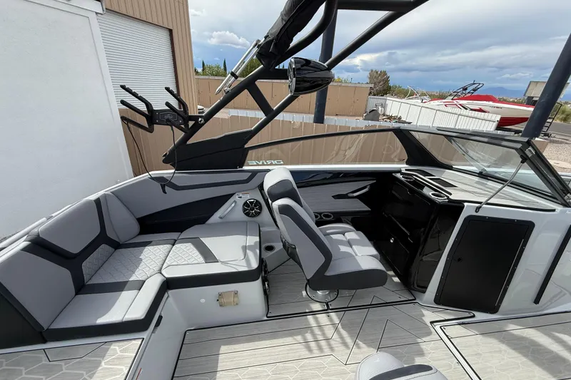Slide: The Image of 2024 Yamaha Boats 222XD interior with sleek seating and modern dashboard design. - 9