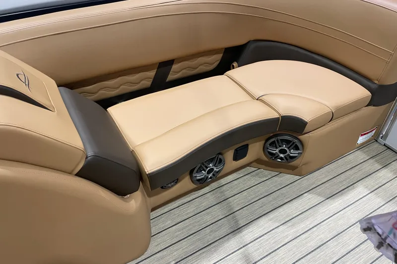 Slide: The Image of Luxurious seating in 2025 SunCatcher Fusion 322RC boat with integrated speakers. - 10