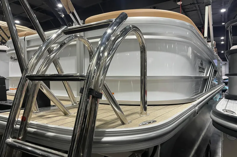 Slide: The Image of 2025 SunCatcher Fusion 322RC boat with stainless steel ladder and sleek design. - 3